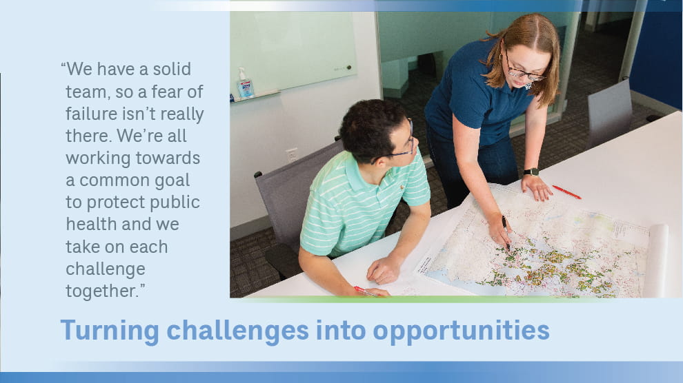 Eileen Sundberg in office with colleague