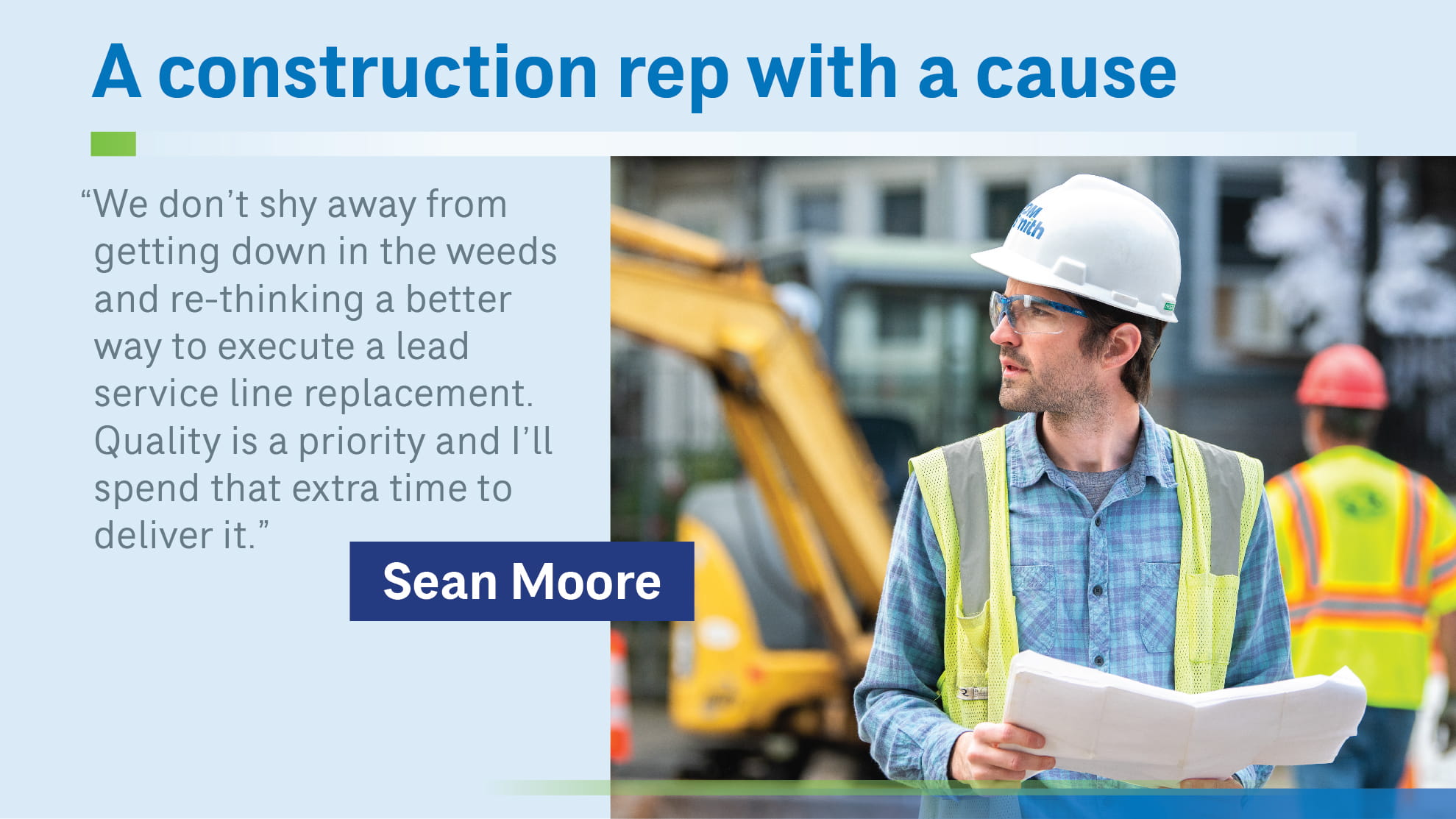 Sean Moore with plans on construction site